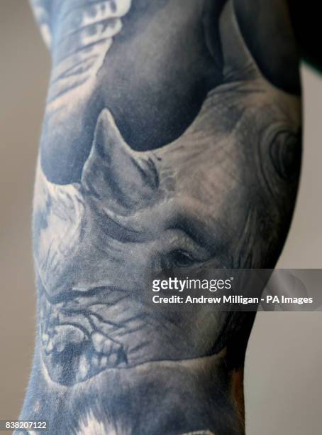 Blair Drummond Safari Park keeper Graeme Alexander, shows his tattoo of rhino Graham, which he has along with tattoos of giraffe Ruby, elephant Mondy...