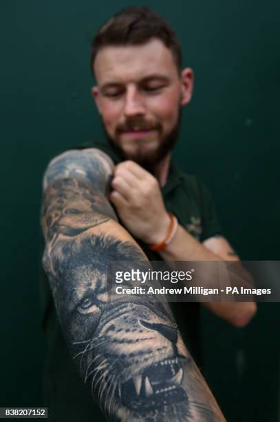 Graeme Alexander with his lion tattoo by Tamas Dikac, the Blair Drummond Safari Park keeper also has tattoos of elephant Mondy, giraffe Ruby, zebra...