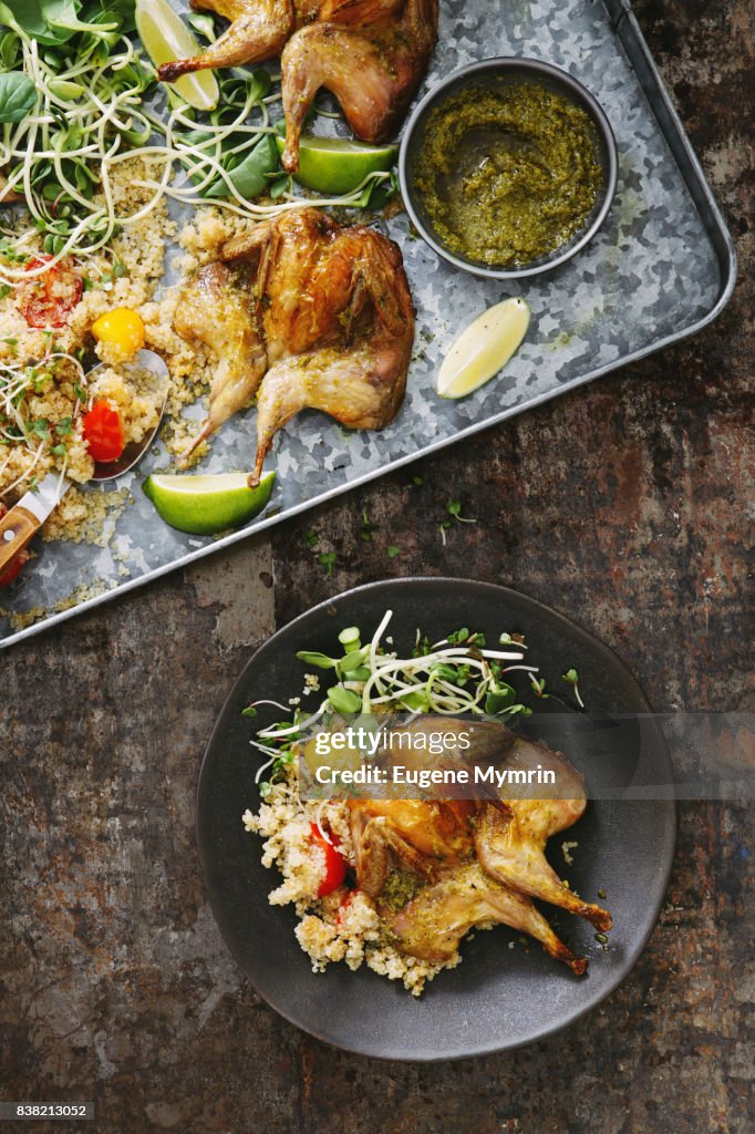 Grilled quails with harissa sauce, quinoa and herbs