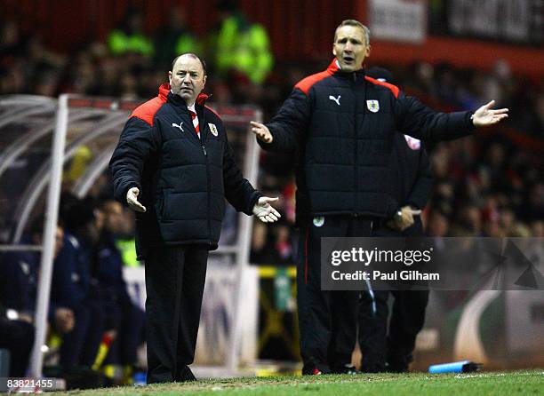 Manager Gary Johnson and his assistant Keith Millen of Bristol City look on from the touchline during the Coca-Cola Championship match between...