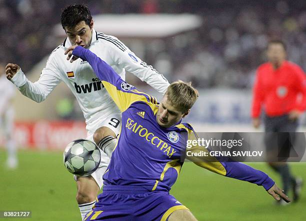 Real Madrid's Argentinian footballer Javier Saviola fights for the ball against Bate Borisov's Belarussian footballer Maksim Skavysh during their...