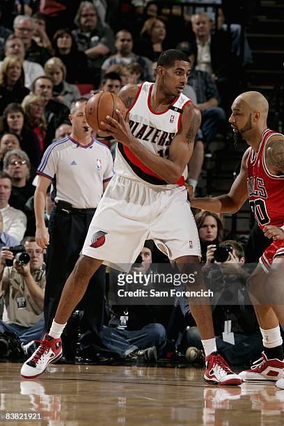 LaMarcus Aldridge of the Portland Trail Blazers looks for an open pass over Drew Gooden of the Chicago Bulls during the game on November 19, 2008 at...