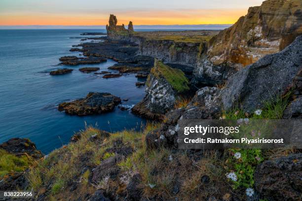 cliffs on the snæfellsnes peninsula in southwest iceland. - hellnar stock pictures, royalty-free photos & images