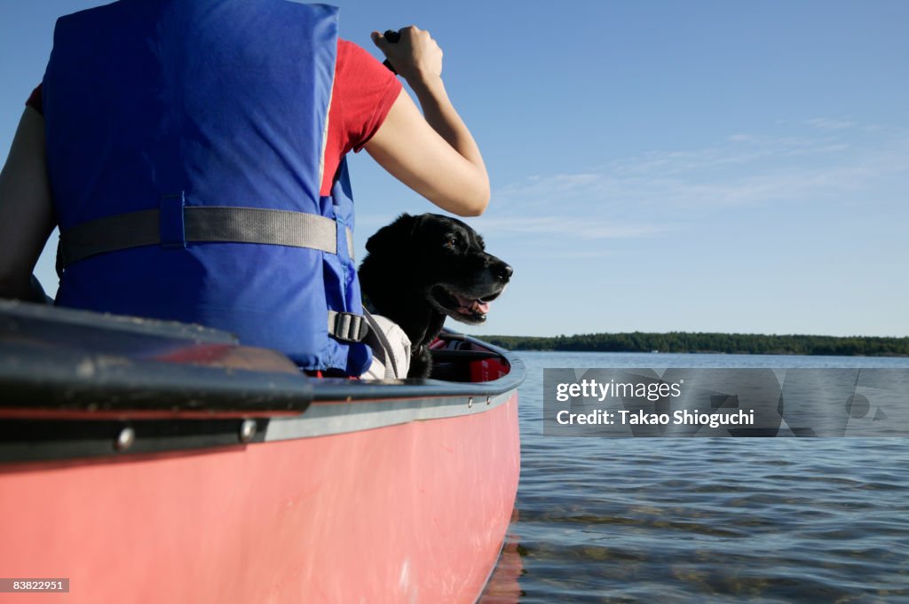 Woman paddling a canoe