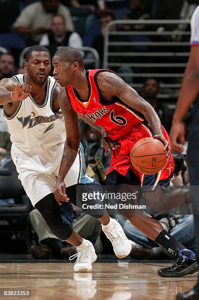 Jamal Crawford of the Golden State Warriors drives against DeShawn Stevenson of the Washington Wizards at the Verizon Center November 25, 2008 in...