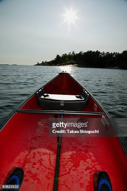 canoe on a lake - killbear provincial park stock pictures, royalty-free photos & images