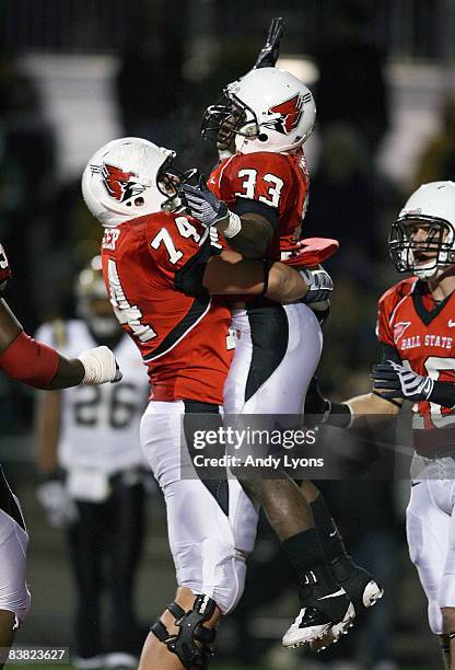 MiQuale Lewis and Michael Switzer of the Ball State Cardinals celebrate after Lewis ran for a touchdown during the Mid-American Conference game...