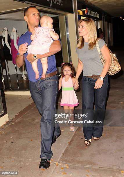 Alex and Cynthia Rodriguez and their children Ella Alexander and Natasha Alexander at Houstons on November 25, 2008 in Miami, Florida.