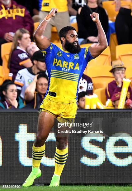 Michael Jennings of the Eels celebrates scoring a try during the round 25 NRL match between the Brisbane Broncos and the Parramatta Eels at Suncorp...