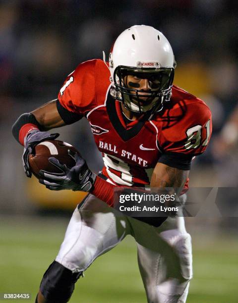 Louis Johnson of the Ball State Cardinals runs with the ball during the Mid-American Conference game against the Western Michigan Broncos at...