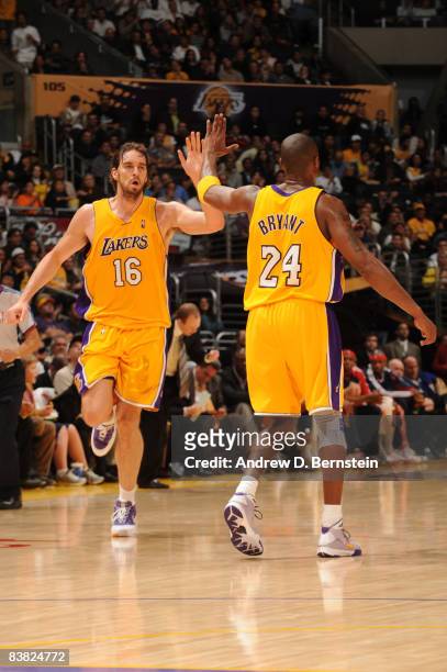 Pau Gasol and Kobe Bryant of the Los Angeles Lakers slap hands during their game against the New Jersey Nets at Staples Center November 25, 2008 in...