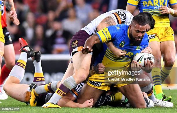 Frank Pritchard of the Eels is tackled during the round 25 NRL match between the Brisbane Broncos and the Parramatta Eels at Suncorp Stadium on...