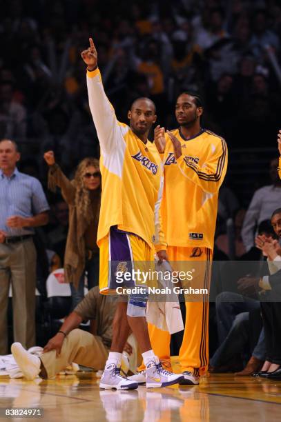 Kobe Bryant of the Los Angeles Lakers gestures from the bench during the fourth quarter of the game against the New Jersey Nets at Staples Center on...