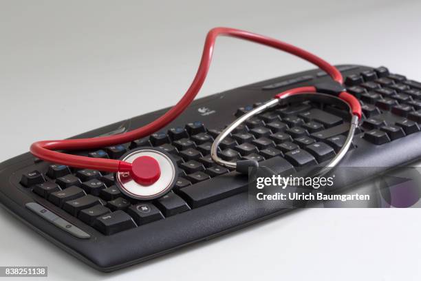 Symbol photo on the topics computer crime, economy crime, espionage, hacker, etc. The photo shows a computer keyboard and a stethoscope.