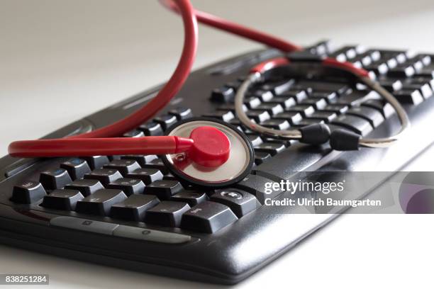 Symbol photo on the topics computer crime, economy crime, espionage, hacker, etc. The photo shows a computer keyboard and a stethoscope.