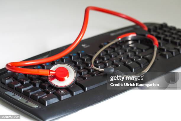 Symbol photo on the topics computer crime, economy crime, espionage, hacker, etc. The photo shows a computer keyboard and a stethoscope.