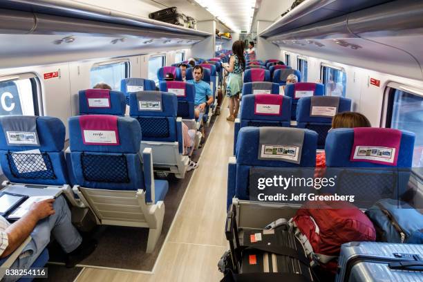 The interior of a AVE high-speed train at Madrid Puerta de Atocha, railway train station.