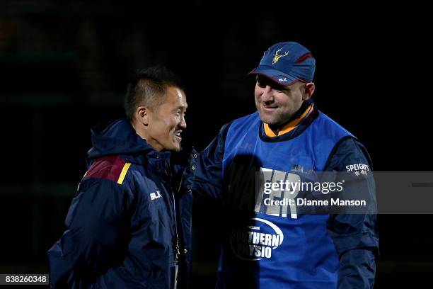 Atsushi Tanabe , and Clarke Dermody, assistant coaches of Southland, chat during team warmup of the Mitre 10 Cup match between Southland and North...