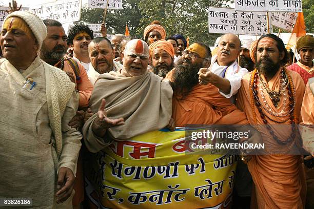 Indian sadhus - holy men - shout anti-government slogans during a protest march in New Delhi on November 26, 2008 against the arrest of holy woman,...