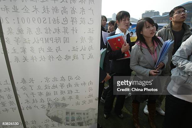 Graduating university students line up for an interview at a job fair on November 26, 2008 in Chengdu of Sichcuan Province, China. The number of...