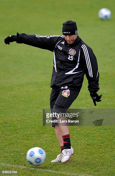 Injured player Bernd Schneider shoots on goal during a Bayer Leverkusen training session on November 26, 2008 in Leverkusen, Germany.