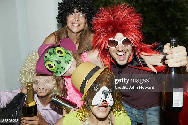 friends in costume at party - costume party stock pictures, royalty-free photos & images