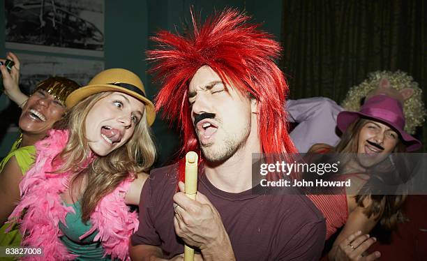 friends dancing at party in costume - toupee stock pictures, royalty-free photos & images