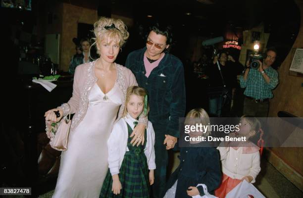 Paula Yates, Michael Hutchence and Paula's children attend a charity premiere after-party for 'A Little Princess' at Planet Hollywood in London, 5th...