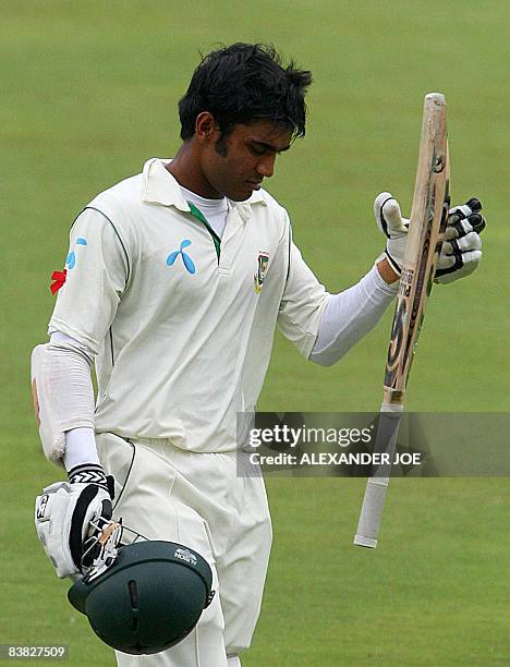 Batsman Shakib Al Hasan of Bangladesh walks off the pitch being caught out by Neil McKenzie of South Africa for 67 runs during the second cricket...