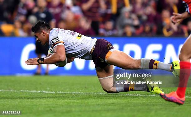 Herman Ese'ese of the Broncos scores a try during the round 25 NRL match between the Brisbane Broncos and the Parramatta Eels at Suncorp Stadium on...