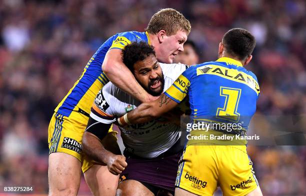 Sam Thaiday of the Broncos takes on the defence during the round 25 NRL match between the Brisbane Broncos and the Parramatta Eels at Suncorp Stadium...