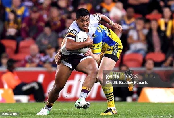 Anthony Milford of the Broncos attempts to break away from the defence during the round 25 NRL match between the Brisbane Broncos and the Parramatta...