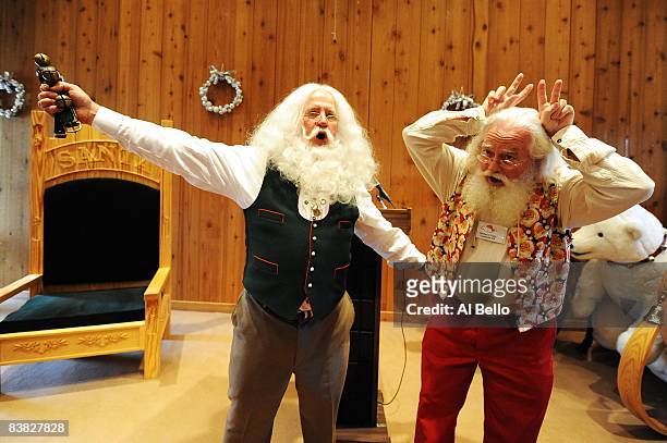 Santa School Dean Tom Valent leads the group in singing the Christmas song Rudolph The Red Nosed Reindeer with Student Wallace Cady, of Towanda,...