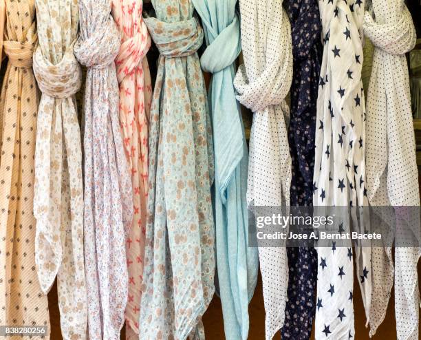 full frame shot of colorful scarves hanging at market for sale in outdoor. street market in begur, catalonia, spain - pashmina schal stock-fotos und bilder