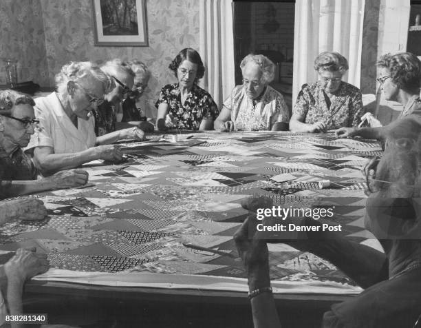 Lots Of Stitching, But No Gossiping Members of the Highland Park Quilters get together once a week for an old-fashioned quilting bee. Shown hard at...