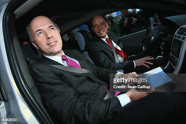 German Transport Minister Wolfgang Tiefensee and Carl-Peter Forster, President and CEO of General Motors Europe AG, prepare to depart for a test...