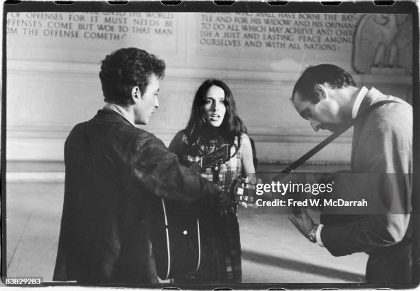 American musicians Bob Dylan , Joan Baez, and Paul Stookey play together in the Lincoln Memorial, Washington DC, August 28, 1963. The three were...