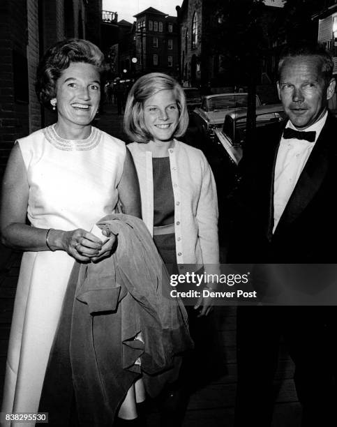 Mr. And Mrs. Kennard Perry arrive with their daughter, Barbara, a Central City flower girl. The Yellow Rose Ball following the play opening honored...