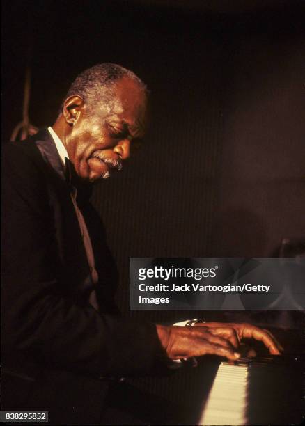 American Jazz composer and musician Hank Jones plays piano as he leads his trio during a performance at the Iridium nightclub, New York, New York,...
