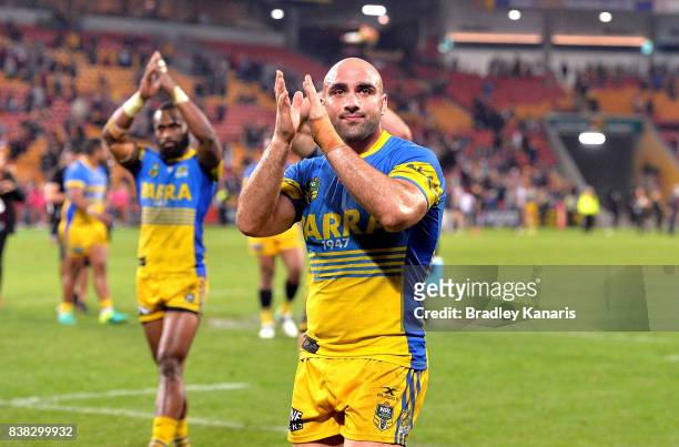 Tim Mannah of the Eels and team mates celebrate victory after the round 25 NRL match between the Brisbane Broncos and the Parramatta Eels at Suncorp...