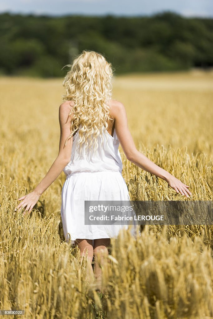 Young woman in wheat field