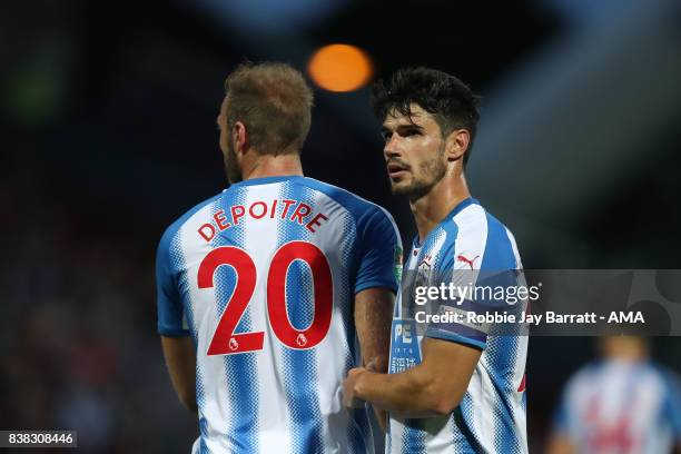 Laurent Depoitre of Huddersfield Town and Christopher Schindler of Huddersfield Town during the Carabao Cup Second Round match between Huddersfield...