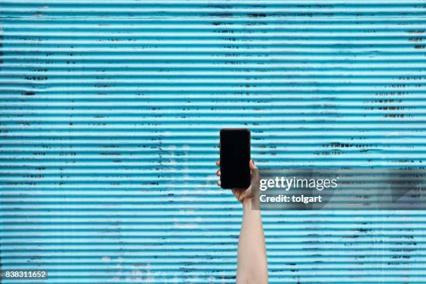 Hand Holding Smartphone High-Res Stock Photo