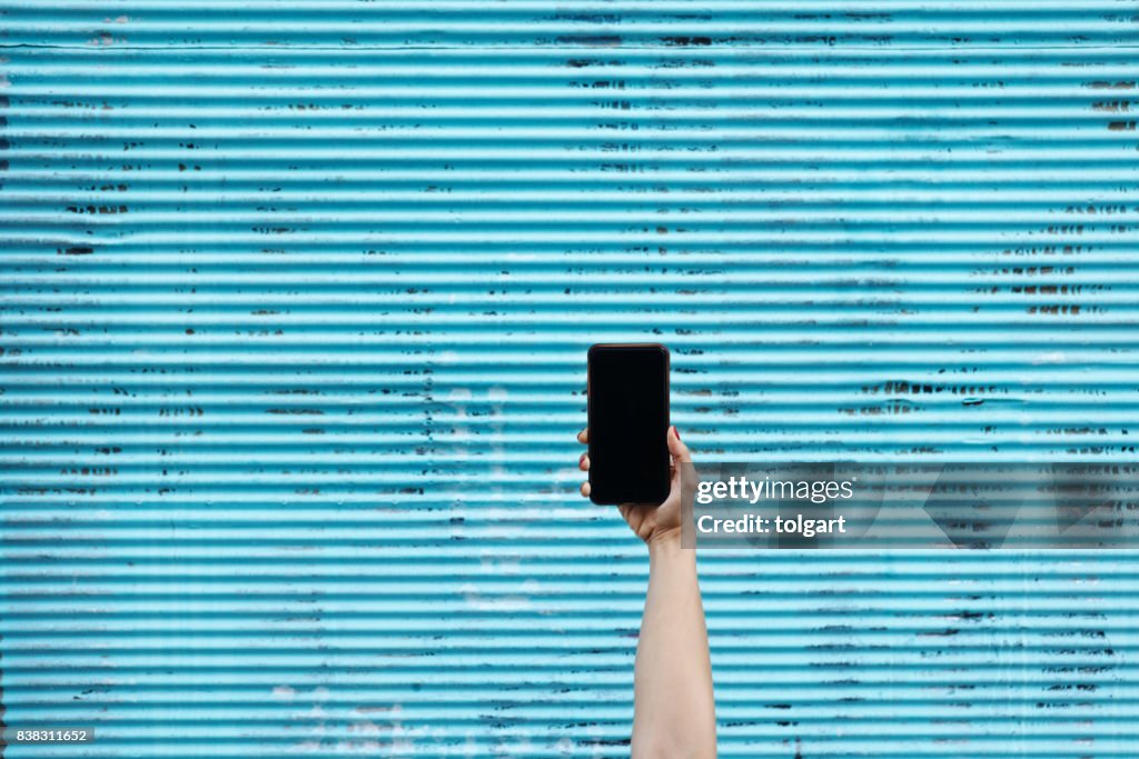 Hand som håller Smartphone