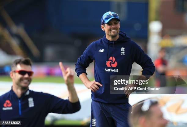 England's Alastair Cook smiles during a nets practice session at Headingley cricket ground in Leeds, northern England on August 24 ahead of the...