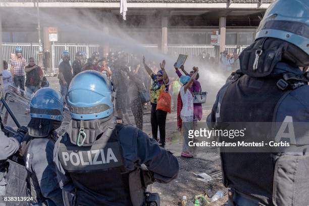 The police use water cannons to remove refugees who camped in Piazza Indipendenza Gardens after their eviction from an occupied building in Piazza...