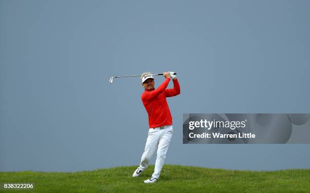 Soren Kjeldsen of Denmark his his second shot on the 12th hole during day one of Made in Denmark at Himmerland Golf & Spa Resort on August 24, 2017...