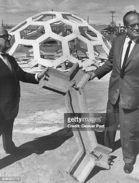 Designers hold type of 'Dog Bone' used to make dome at rear R. Buckminster Fuller, creator of geodesic dome, is at left. Thomas E. Moore, Denver...