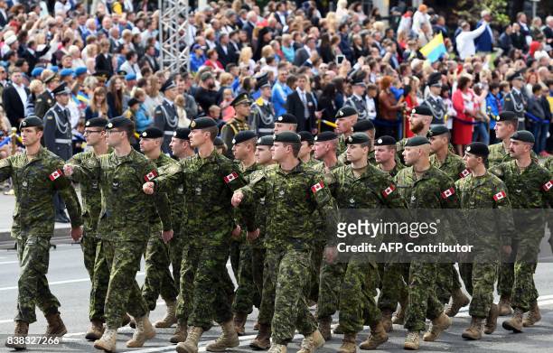 Canadian soldiers march during a military parade in Kiev on August 24, 2017 to celebrate the Independence Day, 26 years since Ukraine gained...