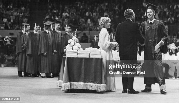 Diplomas Received By Seniors At Abraham Lincoln High School William A. Fischer, 2674 S. Newton St., right, receives diploma from Theodore J....